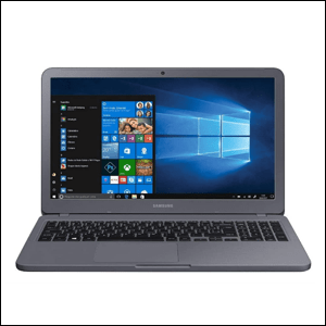 Notebook-Samsung-Book-X40 A imagem mostra um notebook aberto, com a tela mostrando a página inicial do Windows em azul. O notebook é cinza e as teclas do teclado são cinza escuro. O fundo da imagem é branco.
