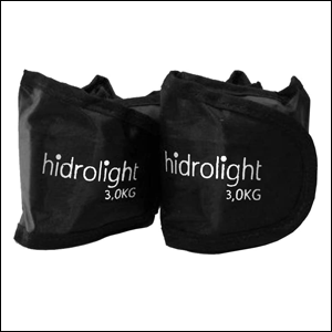 A imagem mostra um par de caneleiras de peso, na cor preta, com o nome da marca "Hidrolight" escrito em branco. O fundo da imagem é branco.