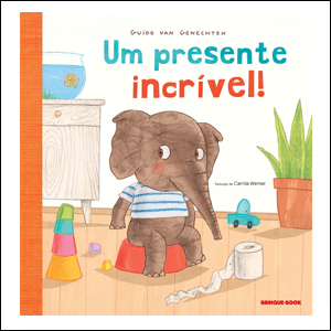 Um-Presente-Incrível A imagem mostra um livro, cuja capa tem uma ilustração de um elefante marrom, com uma blusa listrada, sentado em um pinico vermelho. Ele está numa sala com chão de madeira e paredes brancas e é possível ver um rolo de papel higiênico no chão ao seu lado, alguns brinquedos no chão, um vaso de planta e um armário ao fundo.