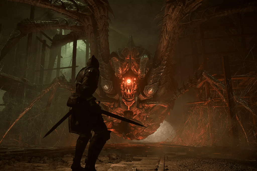 A imagem mostra uma cena de um jogo, na qual é possível ver a silhueta de um guerreiro, de armadura e segurando uma espada, virado de costas, olhando para uma aranha gigante.