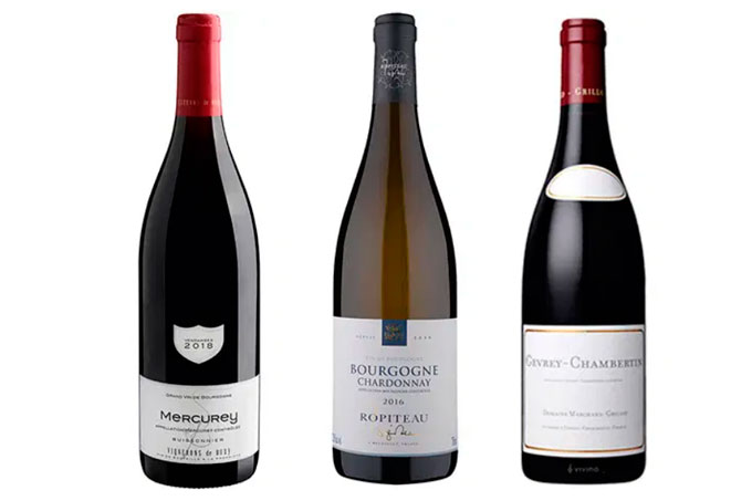 Três vinhos da Borgonha sobre fundo branco